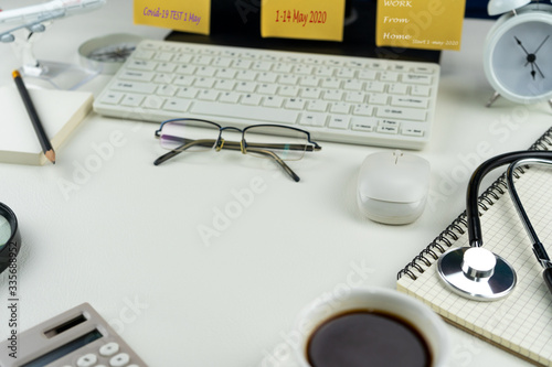 Home workplace with Desktop computer and business objects, Work from home concept The office is Quarantined covid-19 coronavirus.