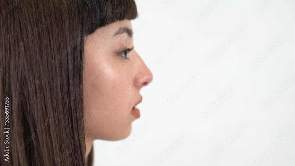 A young asian girl speaks about anything. Close up shot. A young asian girl speaks about anything. Close up shot.