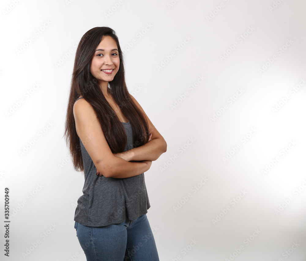 Young Female Smiles As She Stands Proudly Young Female Smiles As She Stands Proudly