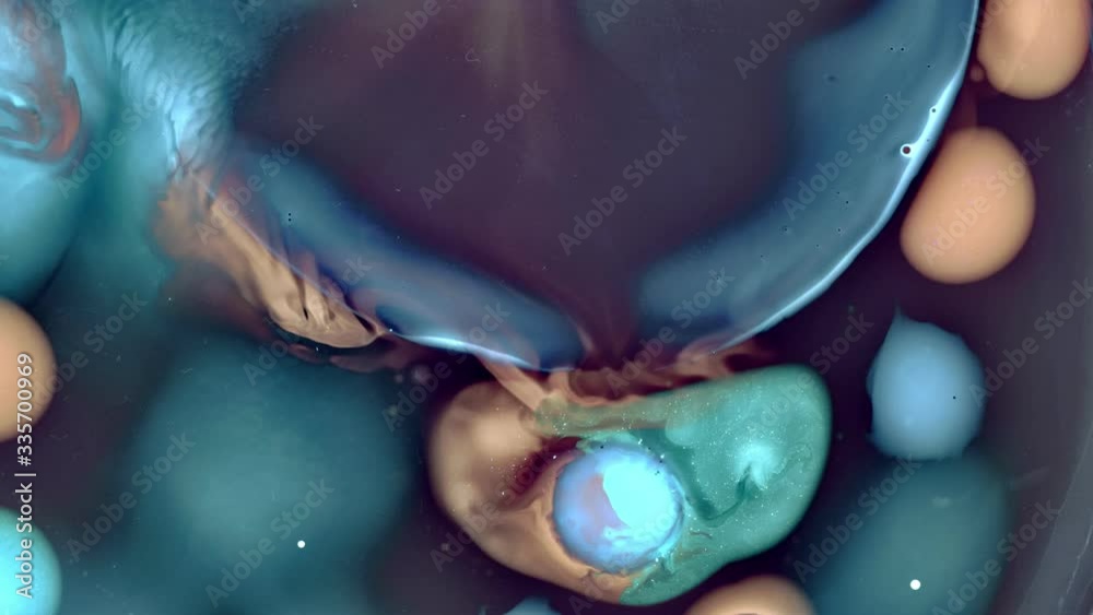 Delightful liquid movement slowly blending color tones.