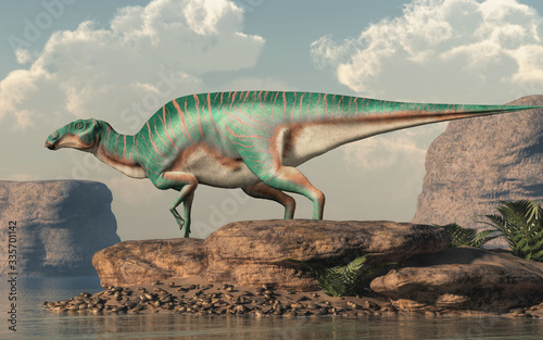 Maiasaura, a hadrosaur, on rocks by a lake. This duck billed dinosaur, now extinct, was an herbivore that lived during the cretaceous period. 3D Rendering. © Daniel Eskridge