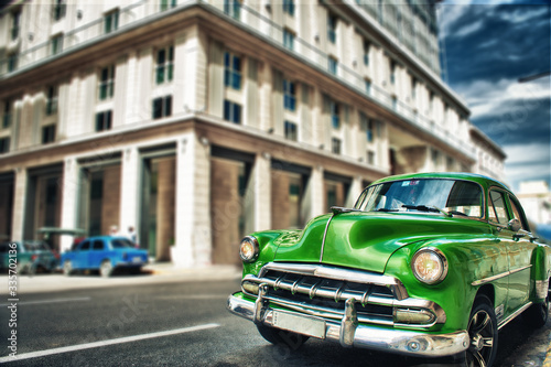 Old vintage car parked on the street of havana city © javier