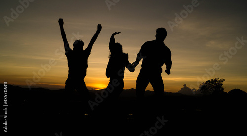 silhouette of a friends on sunset 