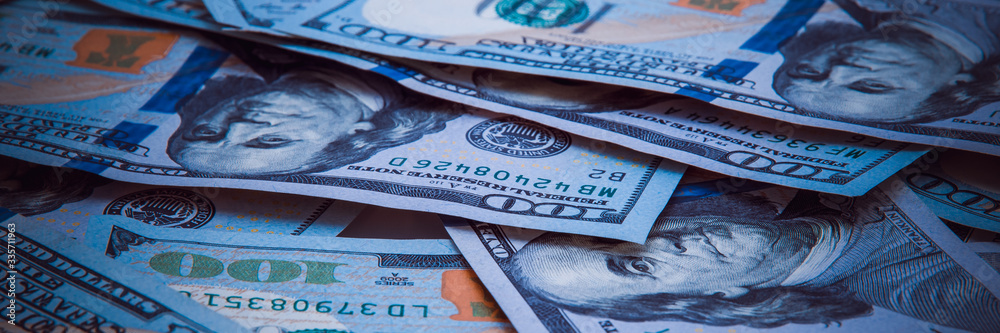 Obraz premium The background of a one hundred dollar bill. Style blue light.