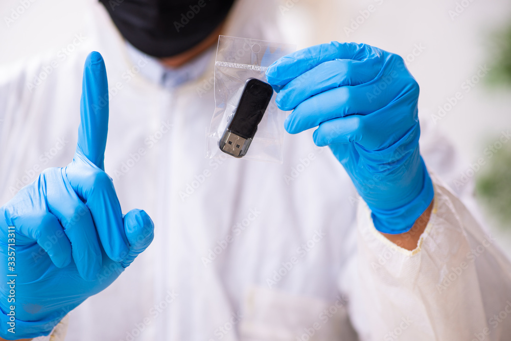 Male expert criminologist working in the lab for evidence Male expert criminologist working in the lab for evidence