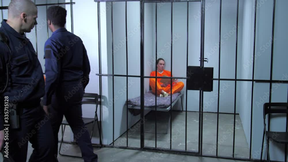The jailers walk around the prison bars The jailers walk around the prison bars