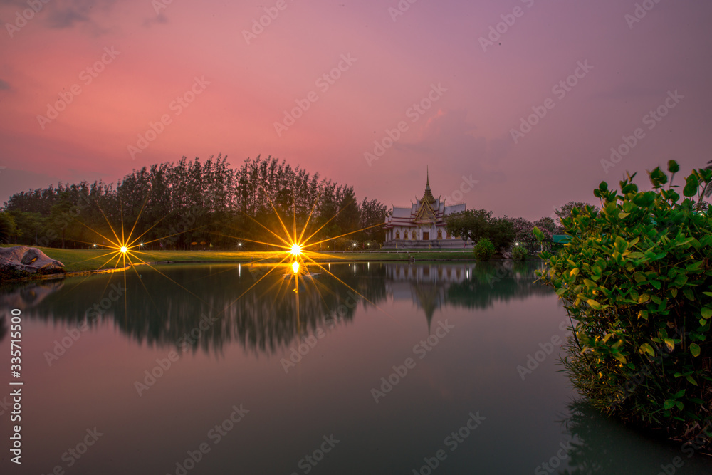 Fototapeta premium Wallpaper Wat Lan Boon Mahawihan Somdet Phra Buddhacharn(Wat Non Kum)is the beauty of the church that reflects the surface of the water,popular tourists come to make merit and take a public photo