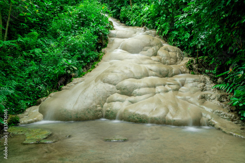 2nd floor Bua Tong waterfall and trees around the green waterfall in the rainy season. At Mae Taeng Chiang Mai Thailand.