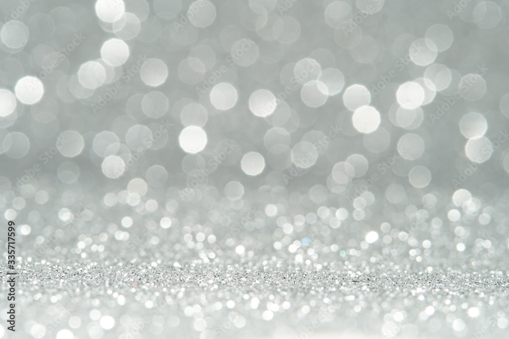 silver and white bokeh lights defocused. abstract background silver and white bokeh lights defocused. abstract background