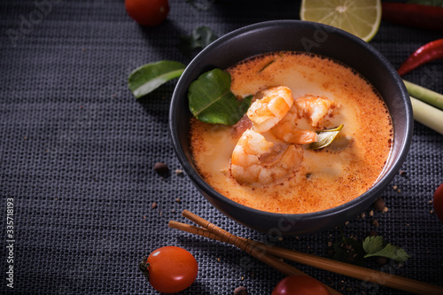 Tom Yum Goong Thai hot spicy soup with Ingredients on dark background