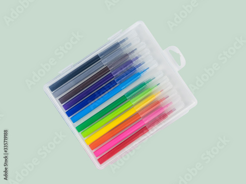 Cuadro en lienzo A set of multi-colored markers in a plastic box on a light background