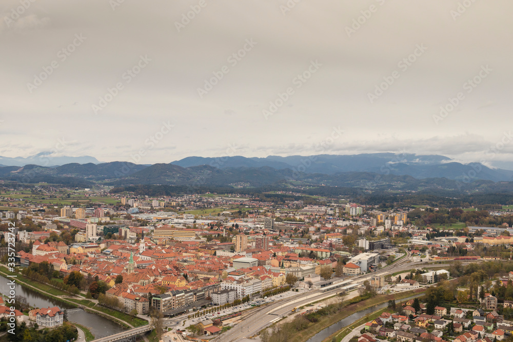 View of the old historical city Celje in Slovenia. Beautiful old city with red roofs and river Savinja nex to the city centre. 