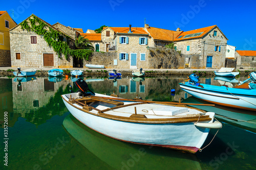 Vrboska mediterranean resort with stone houses and fishing boats, Croatia