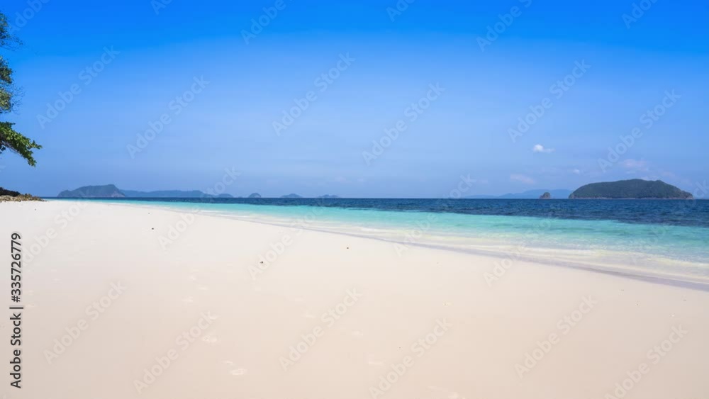 White sand beautiful beach at tropicana country under clear sky and mountain located south of Thailand White sand beautiful beach at tropicana country under clear sky and mountain located south of Thailand