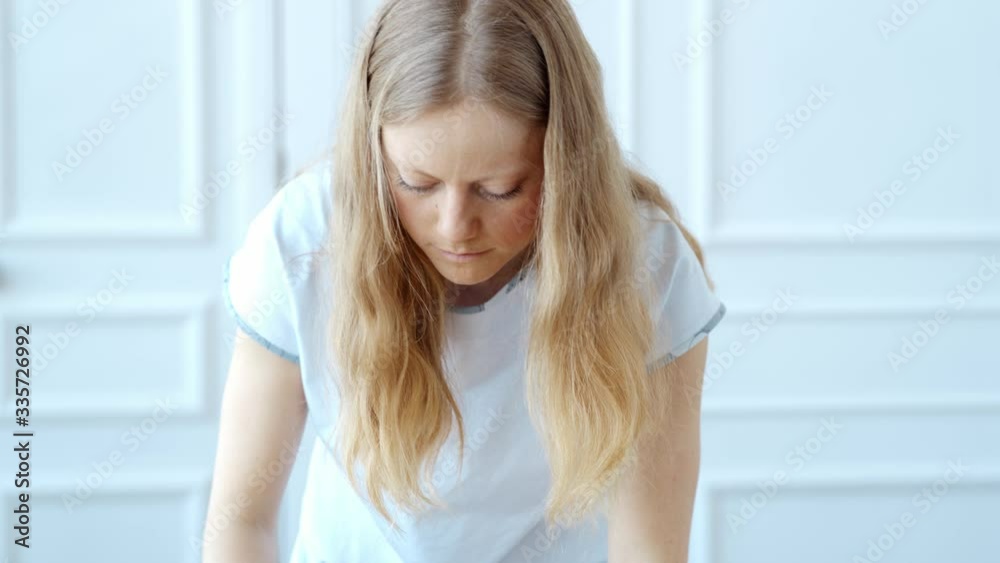 Concept during self-isolation and quarantine. Woman sews a mask Concept during self-isolation and quarantine. Woman sews a mask