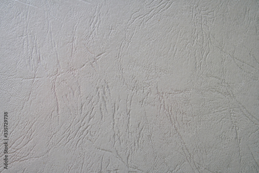 Embossed abstract pattern on a light grey paper Embossed abstract pattern on a light grey paper