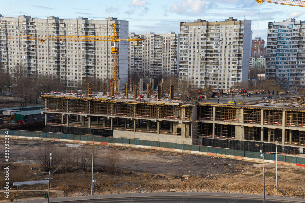 view from a height of a residential quarter of a metropolis with a construction site