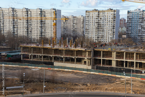 view from a height of a residential quarter of a metropolis with a construction site