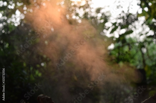 The image blurre of the steam floating from steaming and sunlight passing through