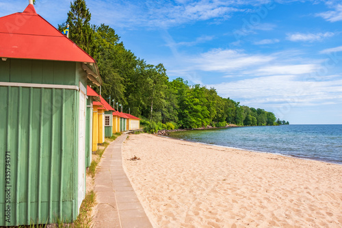 Beach cabins on a sand lakeshore
