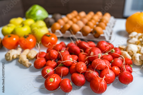 Top view of mixed vegetables. Reddish in front. Organic food concept. Stay healthy. Fresh products consuming. photo