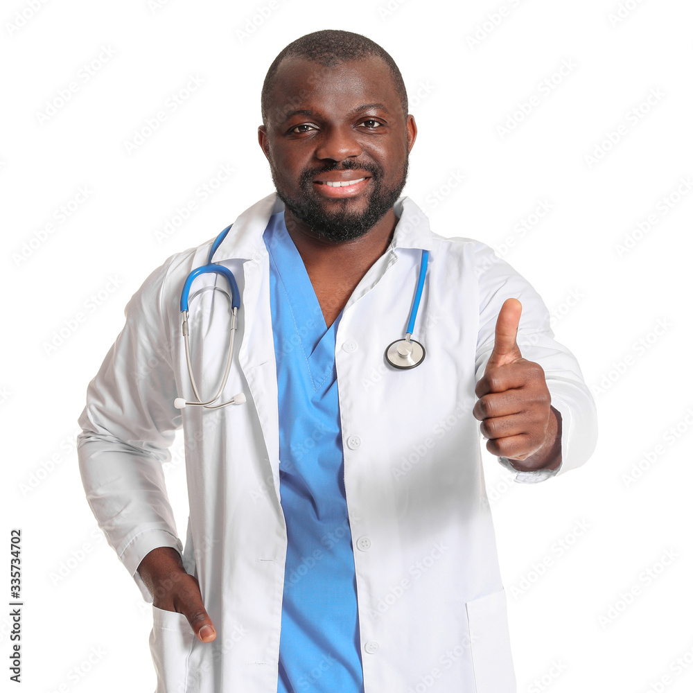 African-American doctor showing thumb-up on white background African-American doctor showing thumb-up on white background