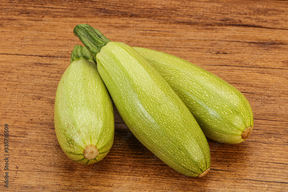 Young tasty zucchini over board Young tasty zucchini over board