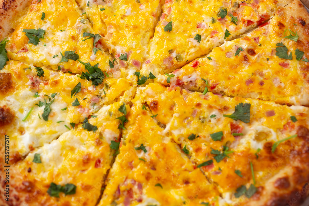 A closeup view of a breakfast pizza pie, as a background.