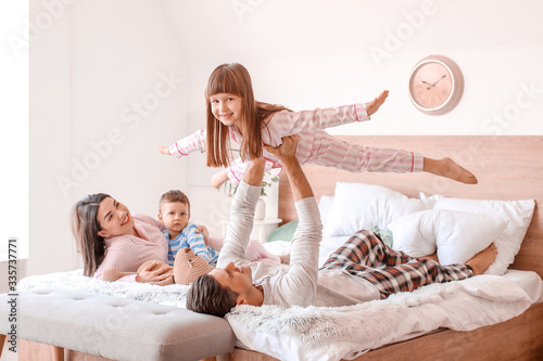Happy family having fun in ...
