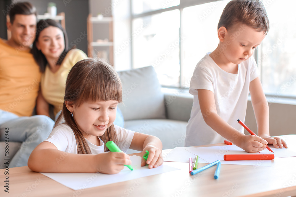 Little children drawing pictures at home Little children drawing pictures at home