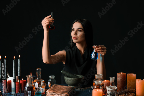 Female alchemist making pot...