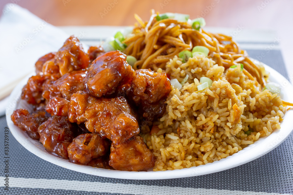 A view of a combo plate of a Chinese fast food restaurant, featuring