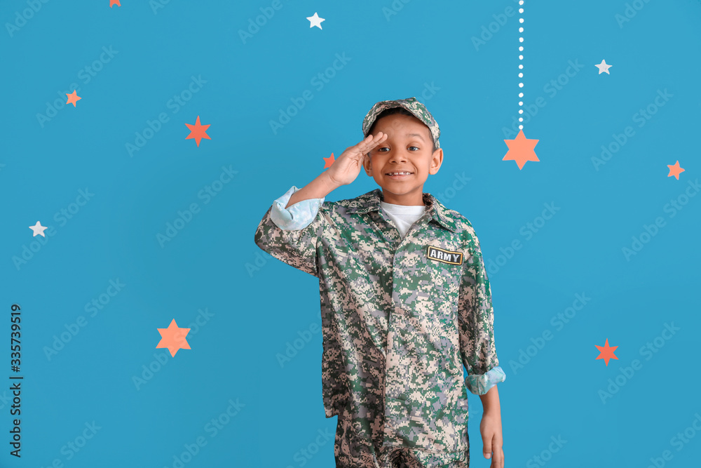 Little saluting African-American soldier on color background Little saluting African-American soldier on color background