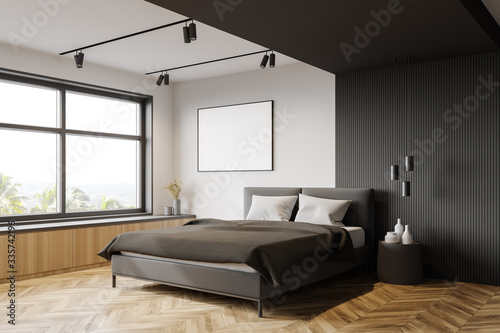White and gray bedroom corner with poster © ImageFlow