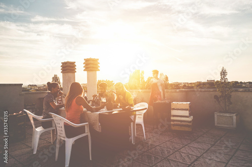 Photography Young friends having barbecue party at sunset on penthouse patio - Happy people