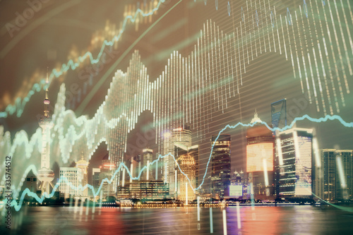 Wallpaper Mural Financial graph on night city scape with tall buildings background double exposure. Analysis concept. Torontodigital.ca