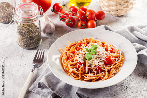 Spaghetti Napoli with parmesan cheese photo