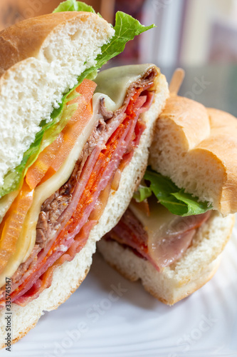 A view of a Italian deli sandwich in a restaurant or kitchen setting.