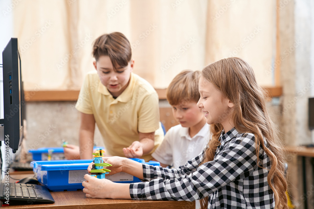 Children using building kit.