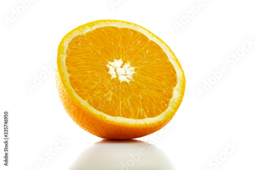 fresh orange fruit half isolated on white