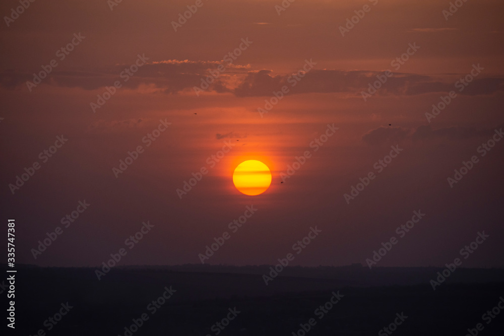 red sun, sunset, clouds