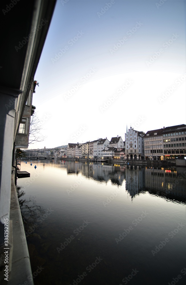 river limmat in zurich switzerland in the morning with old houses facade river limmat in zurich switzerland in the morning with old houses facade
