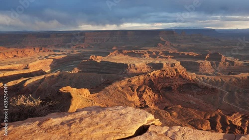 Sunset view of Dead Horse Point State Park, Utah, USA. Сamera moves over a cliff, view of canyon and colorado river. Steadicam shot, 4K