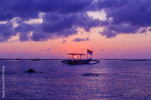 Typical Indonesian fishing boat at the sunset on Kuta Beach, Bali, Indonesia © Alessio Russo