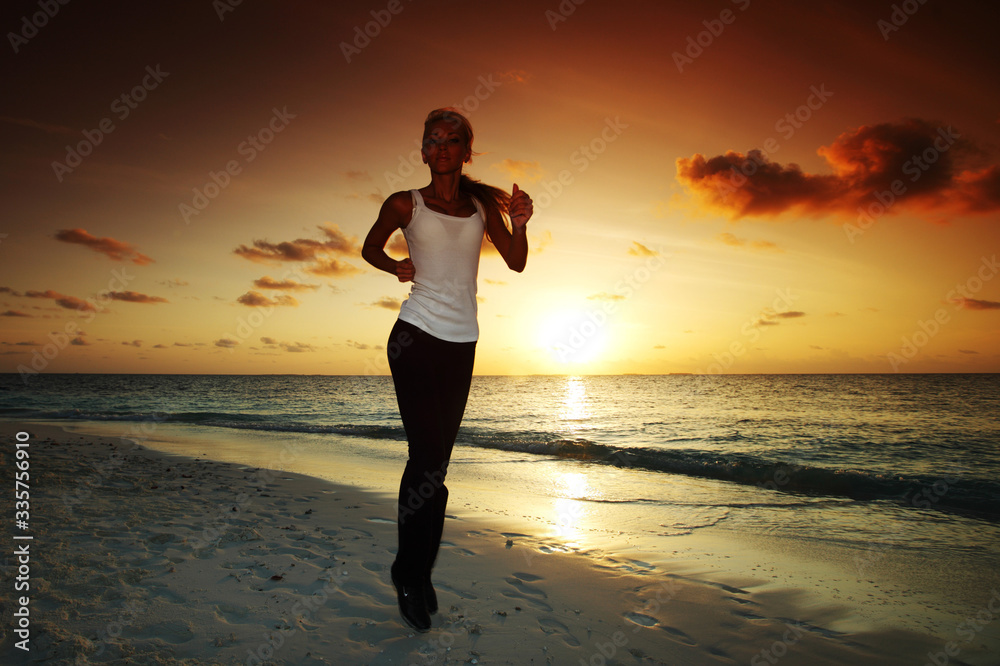 Woman run at sunset