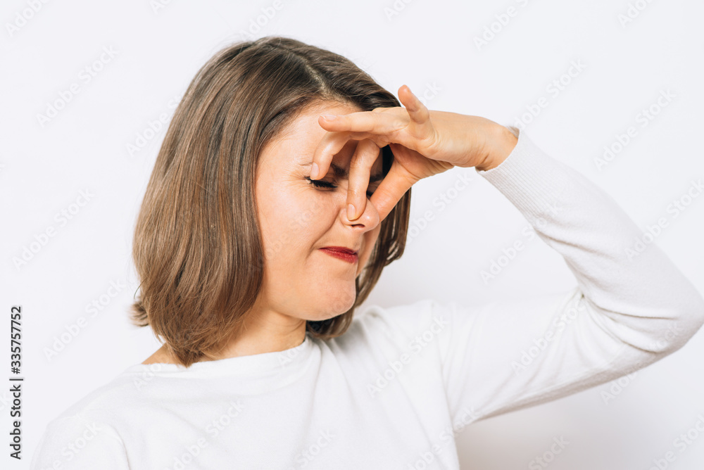 The stench. Closes the woman's nose The stench. Closes the woman's nose