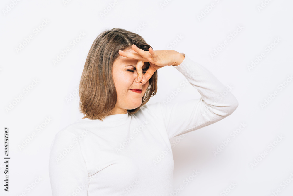 The stench. Closes the woman's nose The stench. Closes the woman's nose