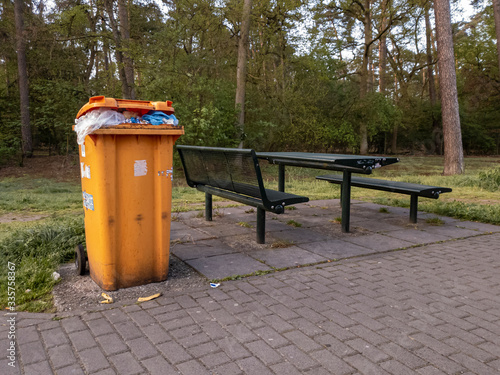 dumpster near the resting place in the parking lot