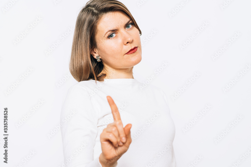 studio portrait of a beautiful girl pointing to the camera studio portrait of a beautiful girl pointing to the camera