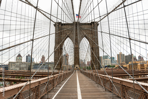 Landscape view of empty Brooklyn Bridge in New York City, empty streets due Covid-19 coronavirus pandemic, USA © Michael Cola